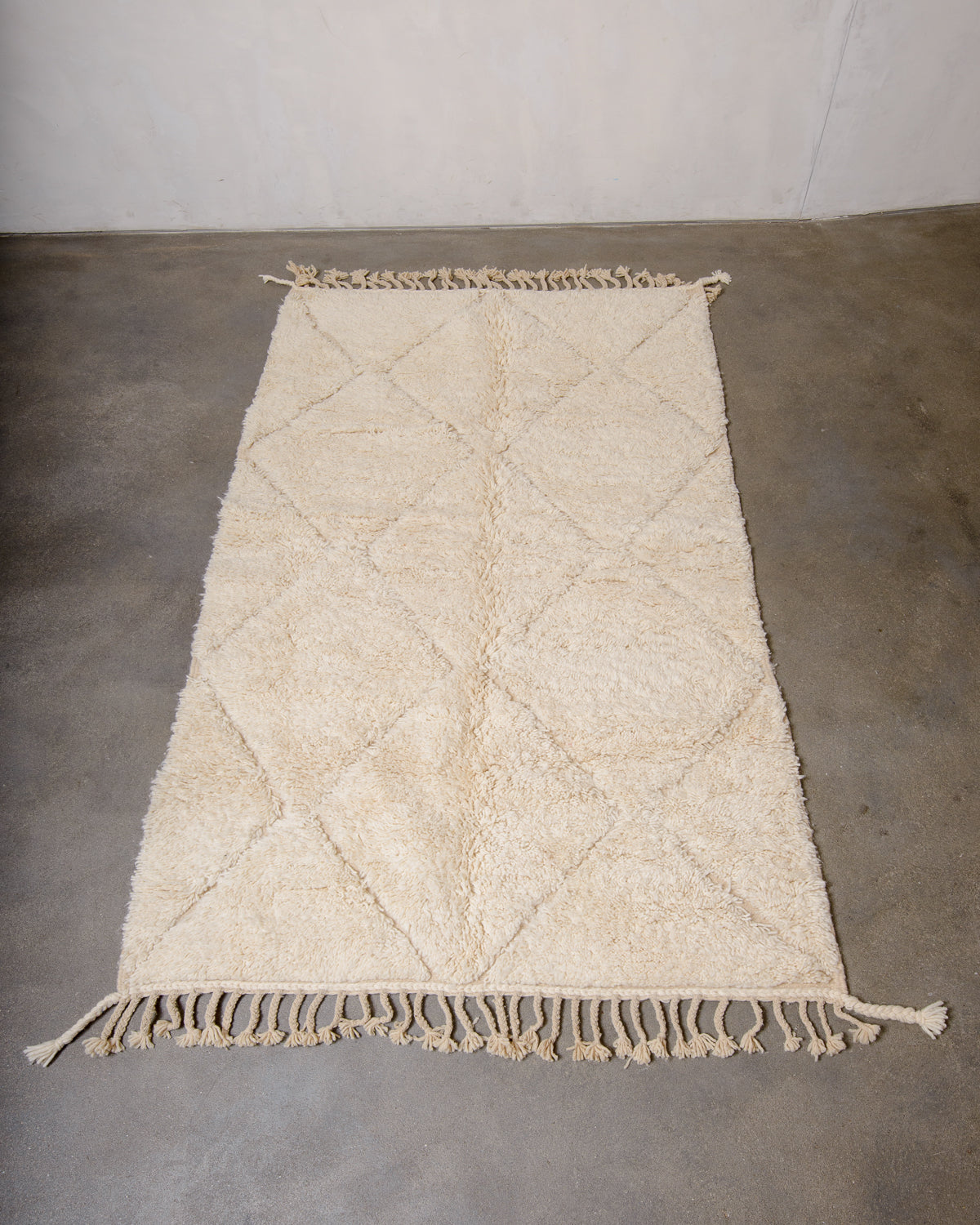 Modern, designer, handcrafted Berber rug from Morocco. Beniourain carpet with minimalist design, natural wool pile and a fluffy texture.